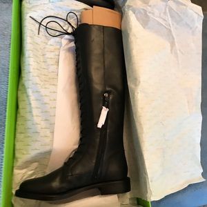 Black leather lace boots. Inside zipper. Top laces are real. Not wide calf.